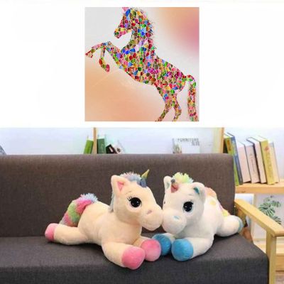 Peluche licorne transformée en coussin bébé
