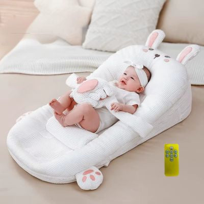 réducteur de lit bébé main apaisante anti-coliques lapin