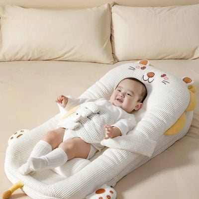 réducteur de lit bébé main apaisante anti-coliques reposant et sécuritaire