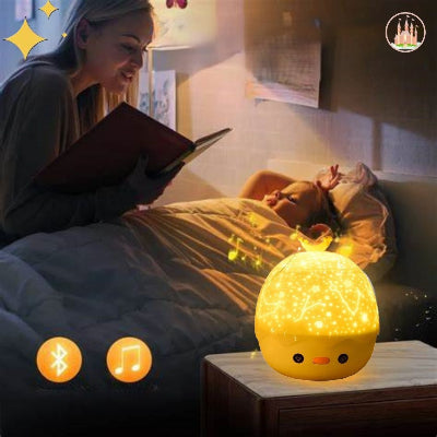 Veilleuse musicale poussin avec projecteur rotatif et bluetooth CrownedGlow™